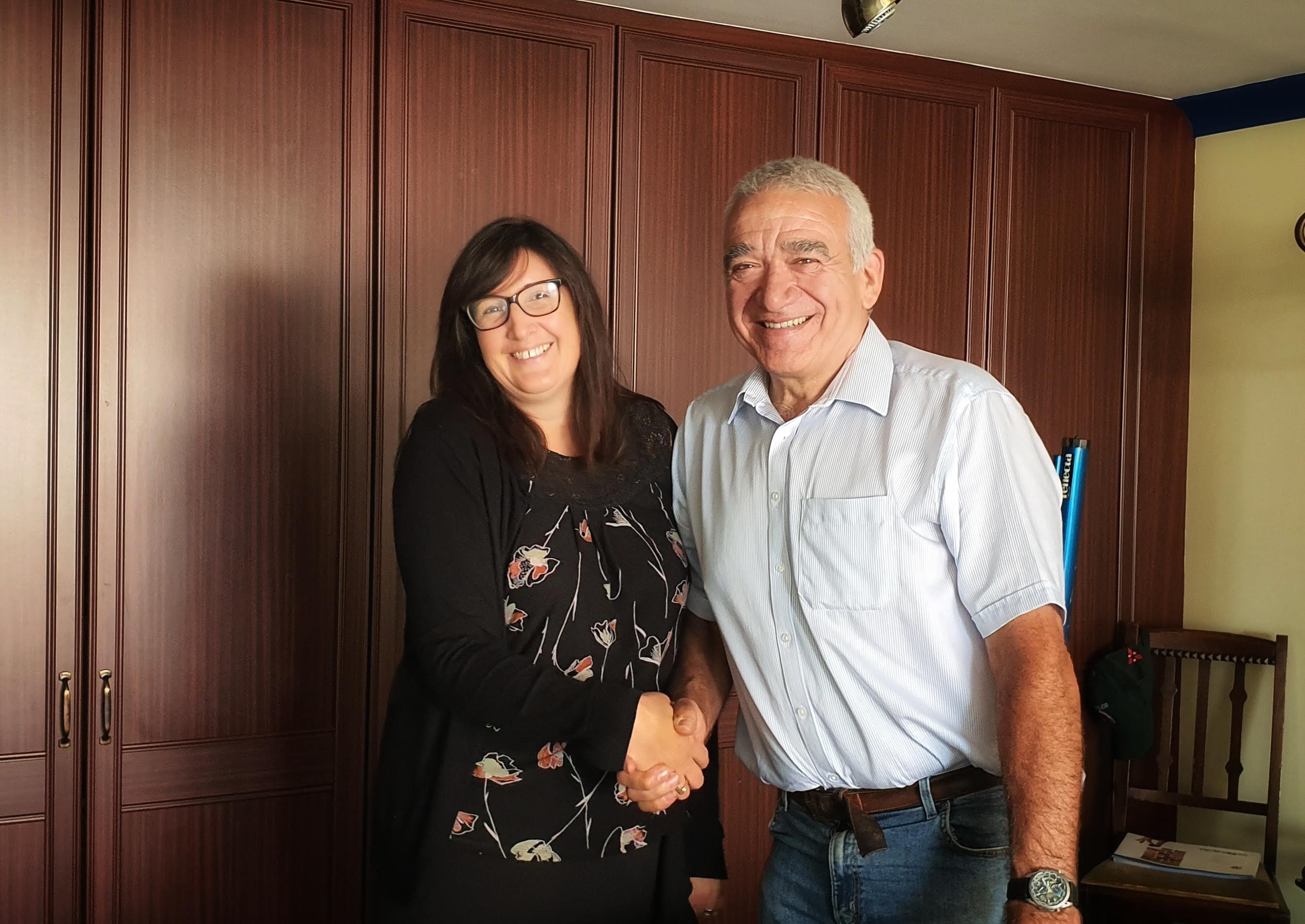 Bev Greetham congratulated by Robert Oldershaw for his long service award