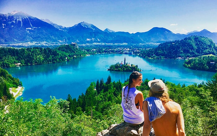 Travelling couple overlooking beautiful vista | Q+H London Blog