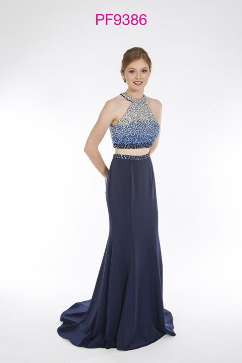 Prom girl wearing 2 piece gown in Navy with beaded bodice and fitted jersey skirt