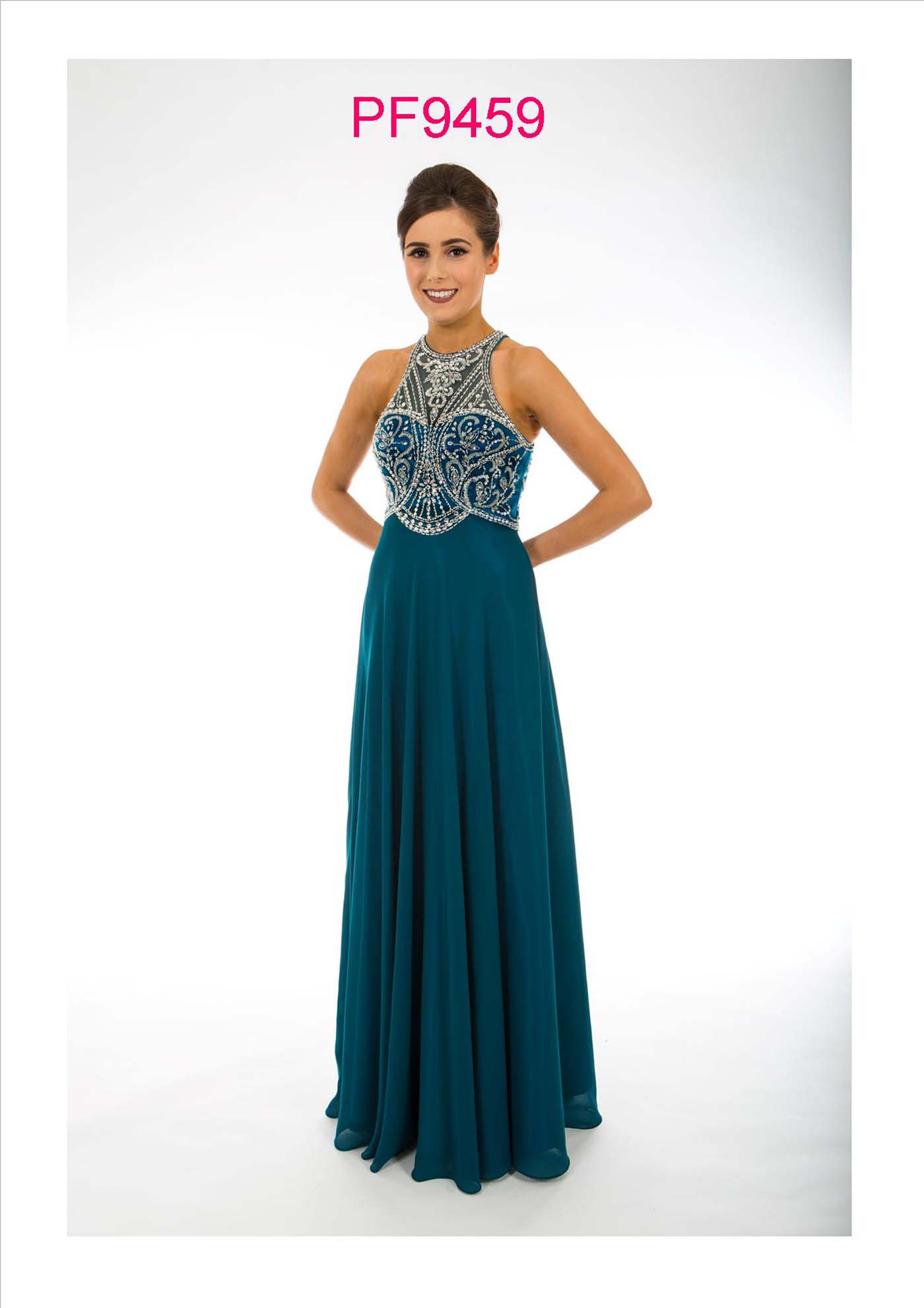 Prom girl wearing green chiffon gown with full skirt and silver beaded bodice