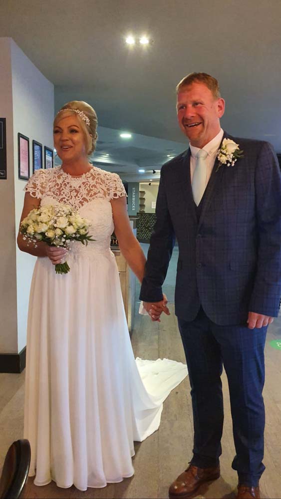 Bride and groom walking back down the aisle