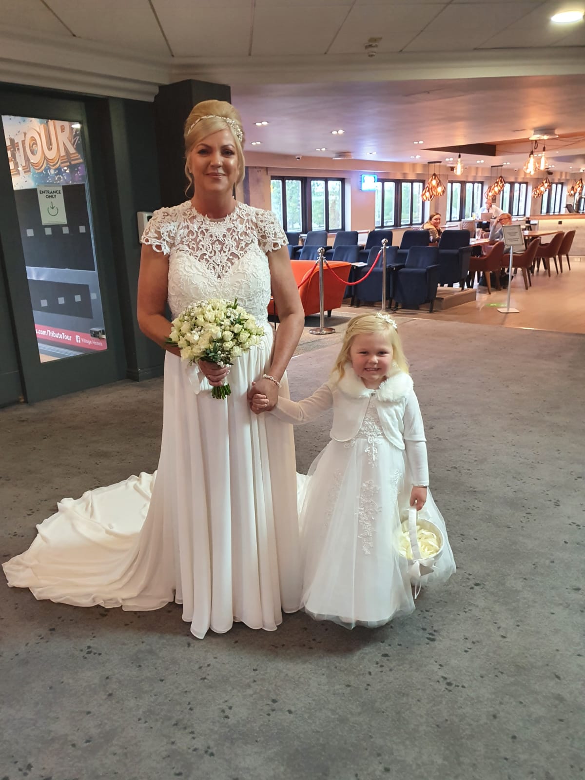 Bride and her flower girl in ivory matching dresses