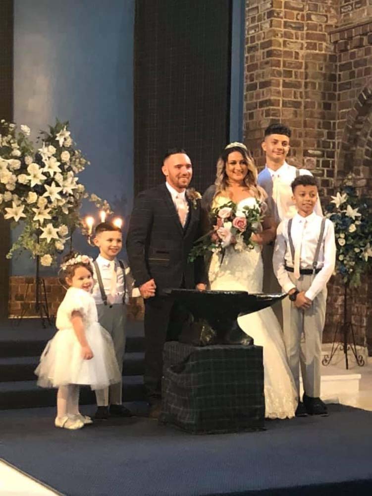 The bride and groom and their attendants at the Anvil Hall, Gretna Green.