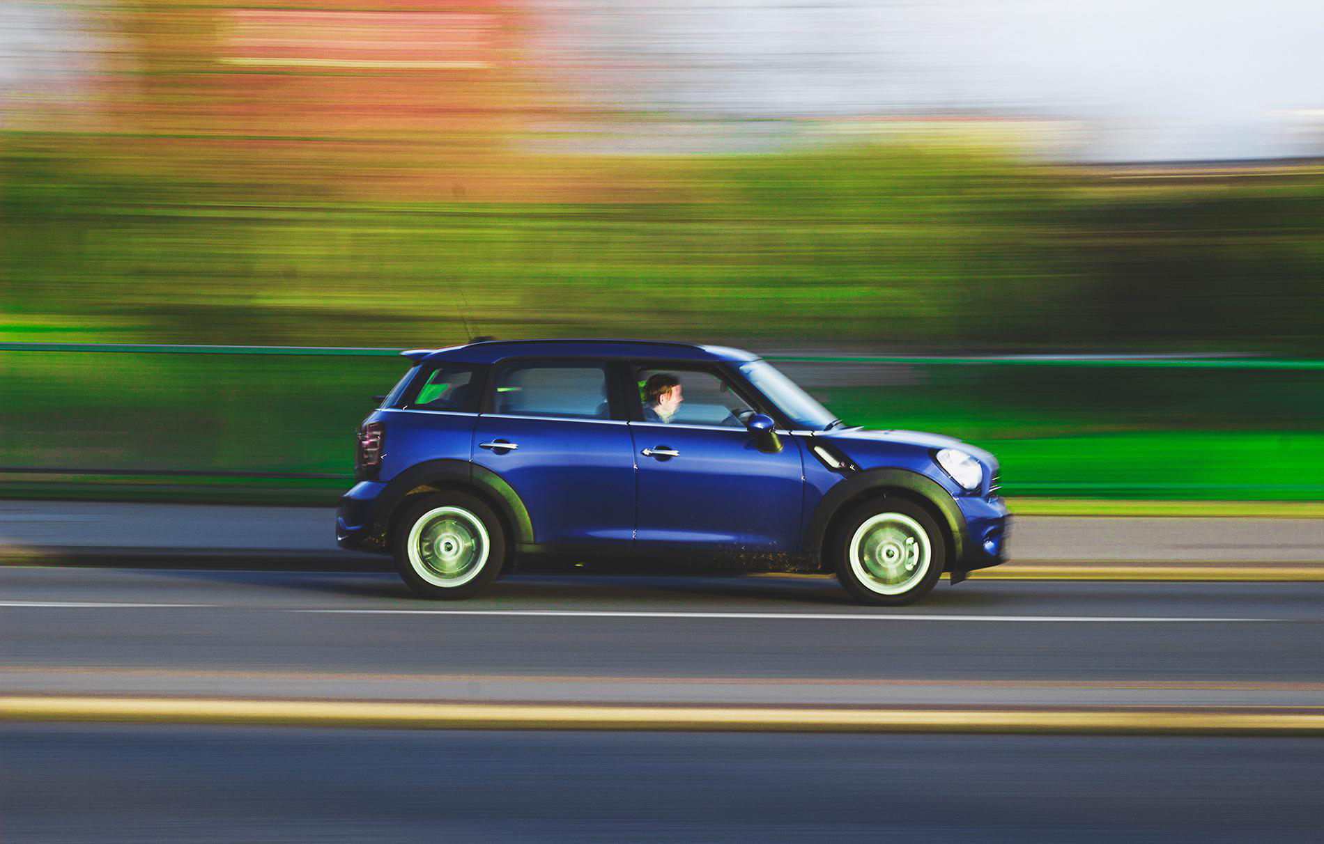 Mini Cooper driving down road