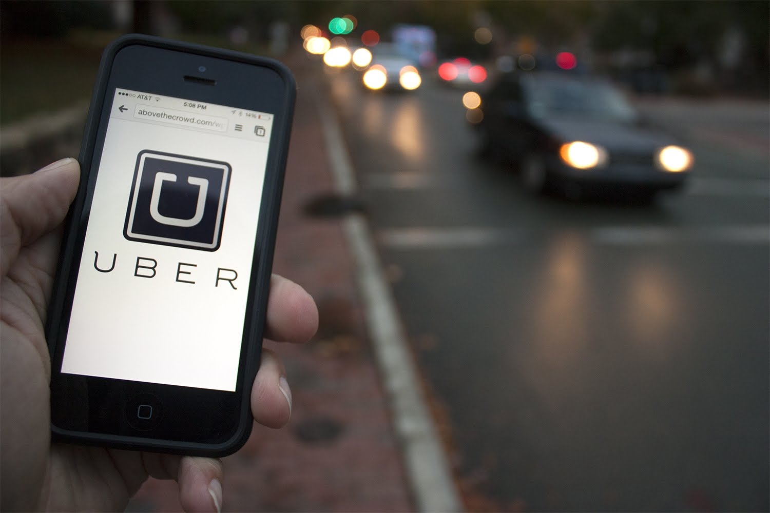 Person with smartphone requesting Uber