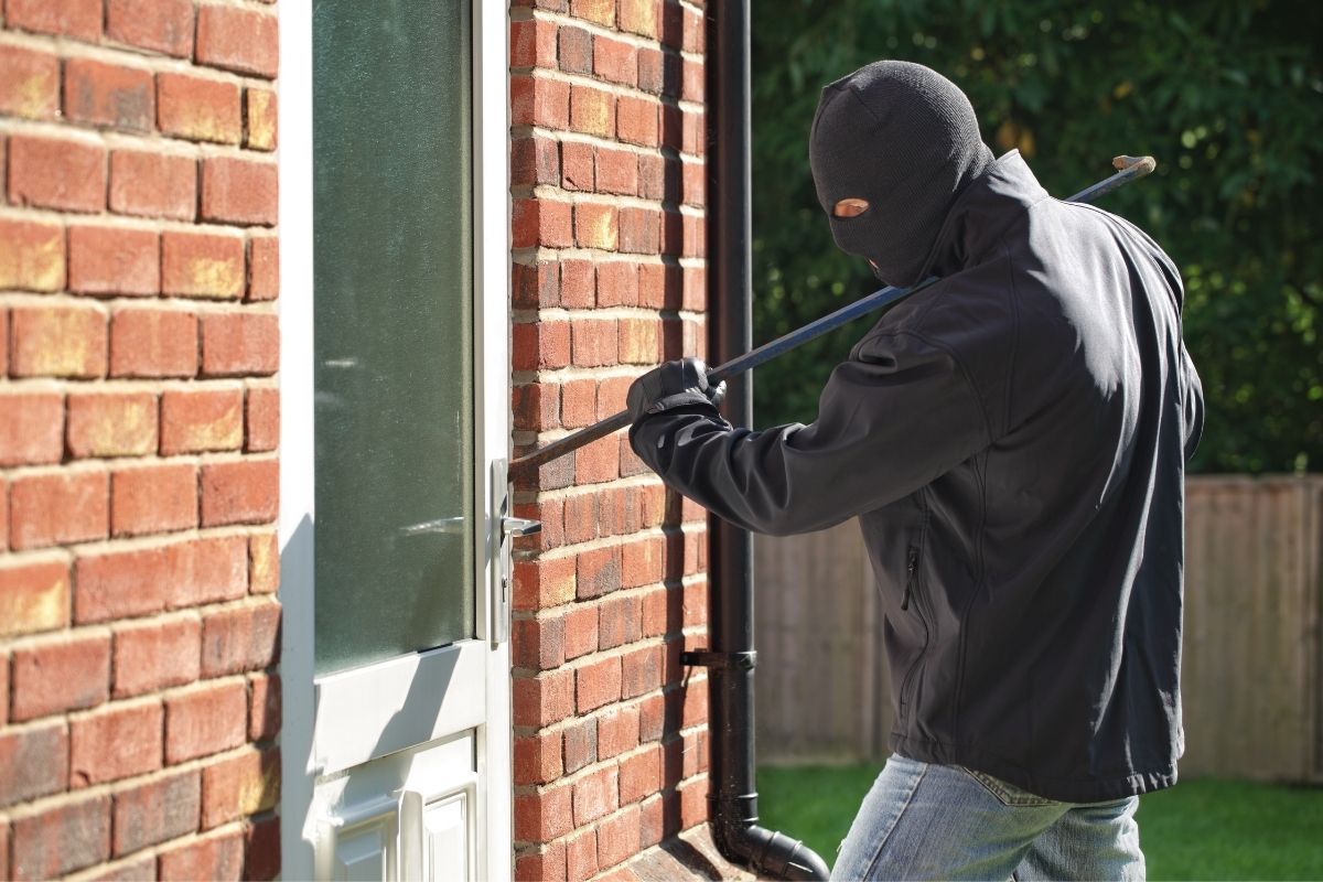 Burglar breaking into home