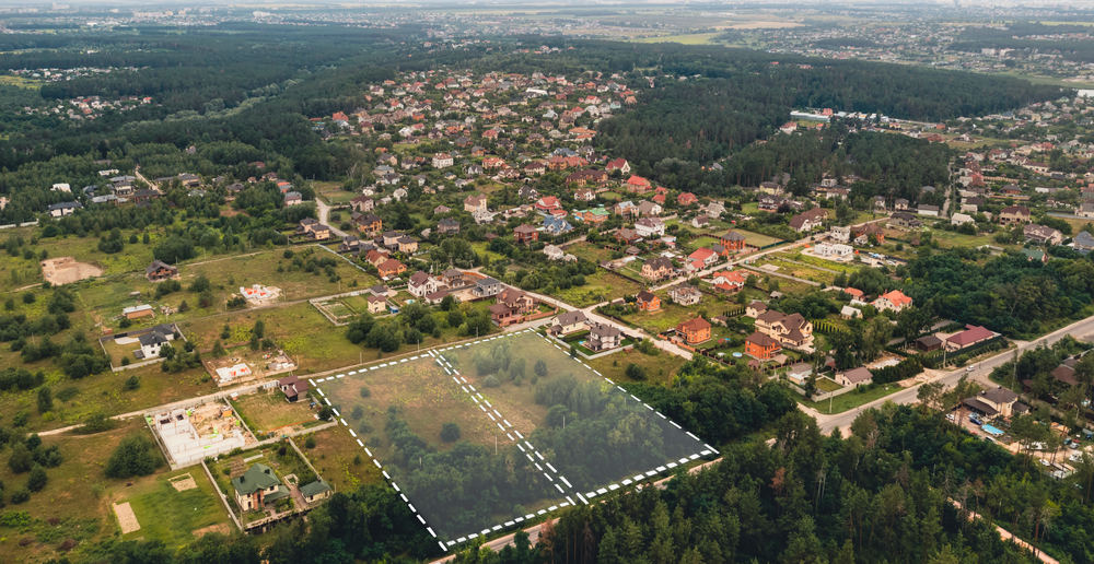 Marked vacant land for construction and sale.