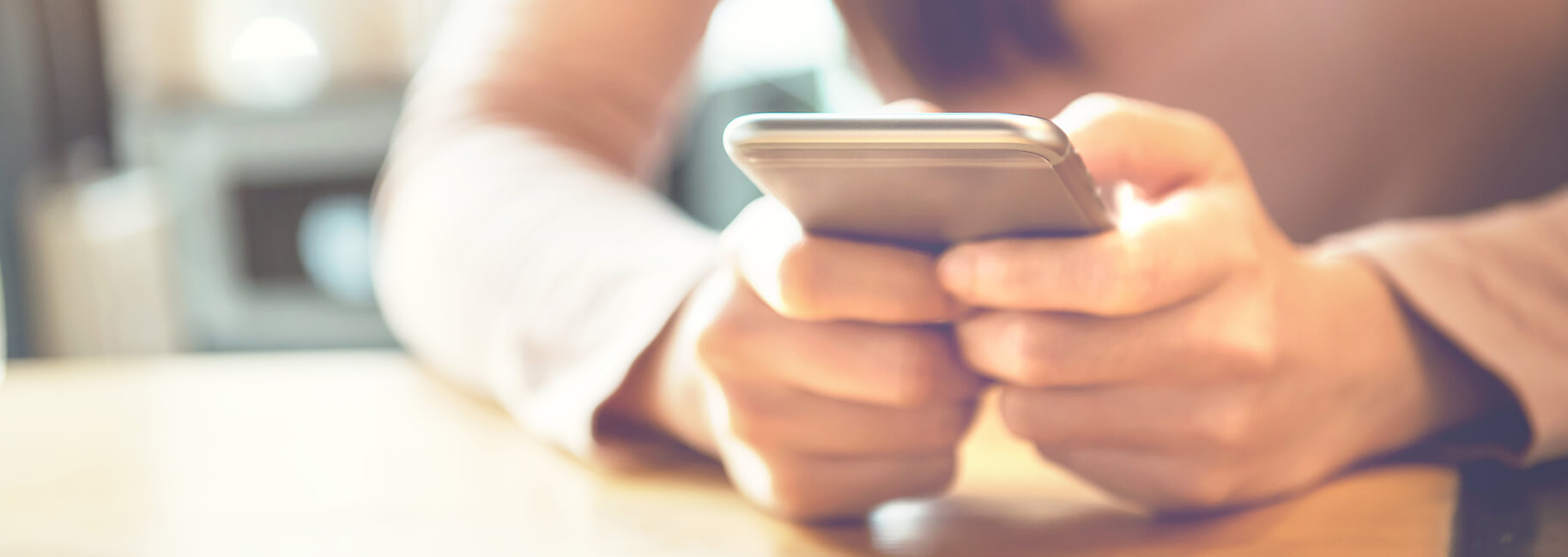 Woman's hands holding a smartphone - The Certification Prep Playbook - OttoLearn Personalized Learning