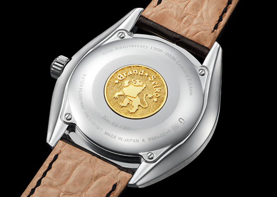 The case back carries a Grand Seiko emblem in 18k yellow gold