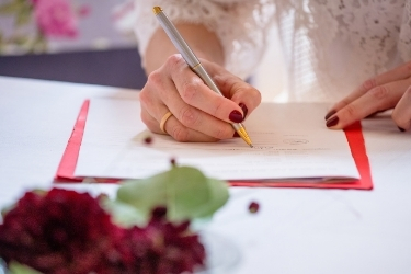 Bride singing their marriage license