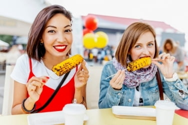 Women eating at a festival