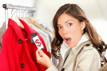 Woman looking at a price tag