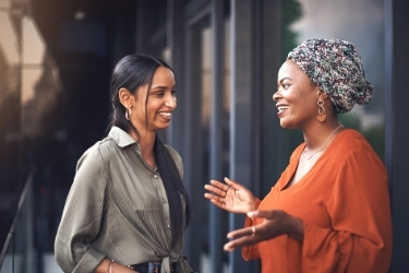 Woman talking to another woman about her business