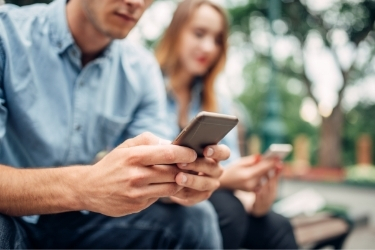 People using their mobile phone to create some buzz