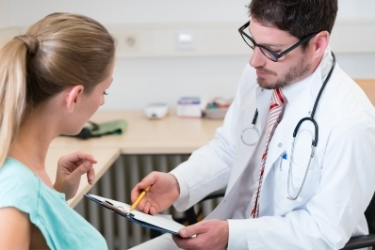 Doctor explaining a woman her health condition