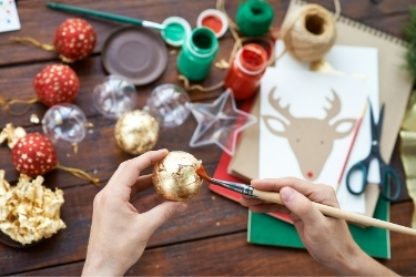 Hands doing Christmas crafting