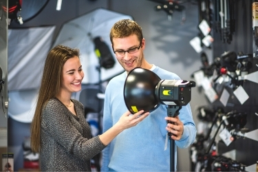 Woman and Man buying a photography lamp