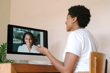 Woman doing a video conference with her manager