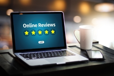 Online Reviews - Five stars in a laptop screen
