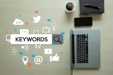 Keywords next to a laptop