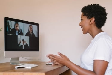 Woman being interviewed remotely
