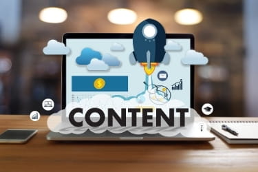 Laptop open with the word "Content"