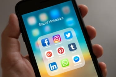 Mobile phone open with different social media channels