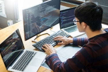 Software developer working in front of a computer