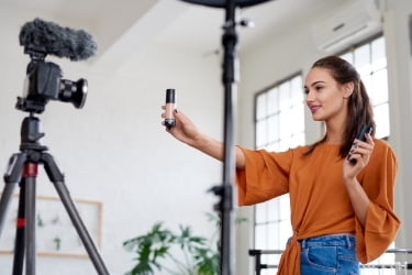 Seller filming herself with product