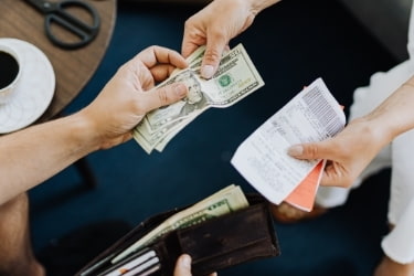 Person paying in cash