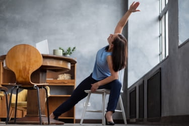 Woman doing chair yoga