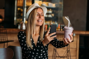 Influencer taking photo of a beverage