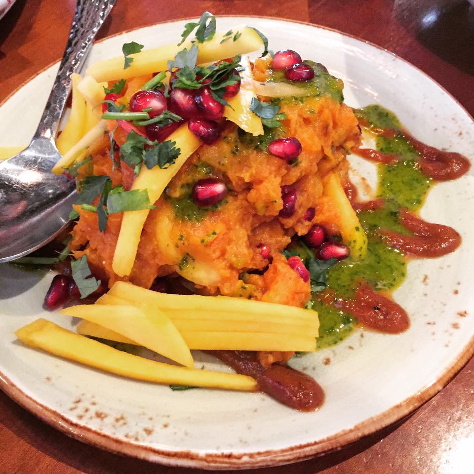 Sharkandi Chaat with sweet potato salad mixed with roasted cumin, chaat masala and garnished with mango