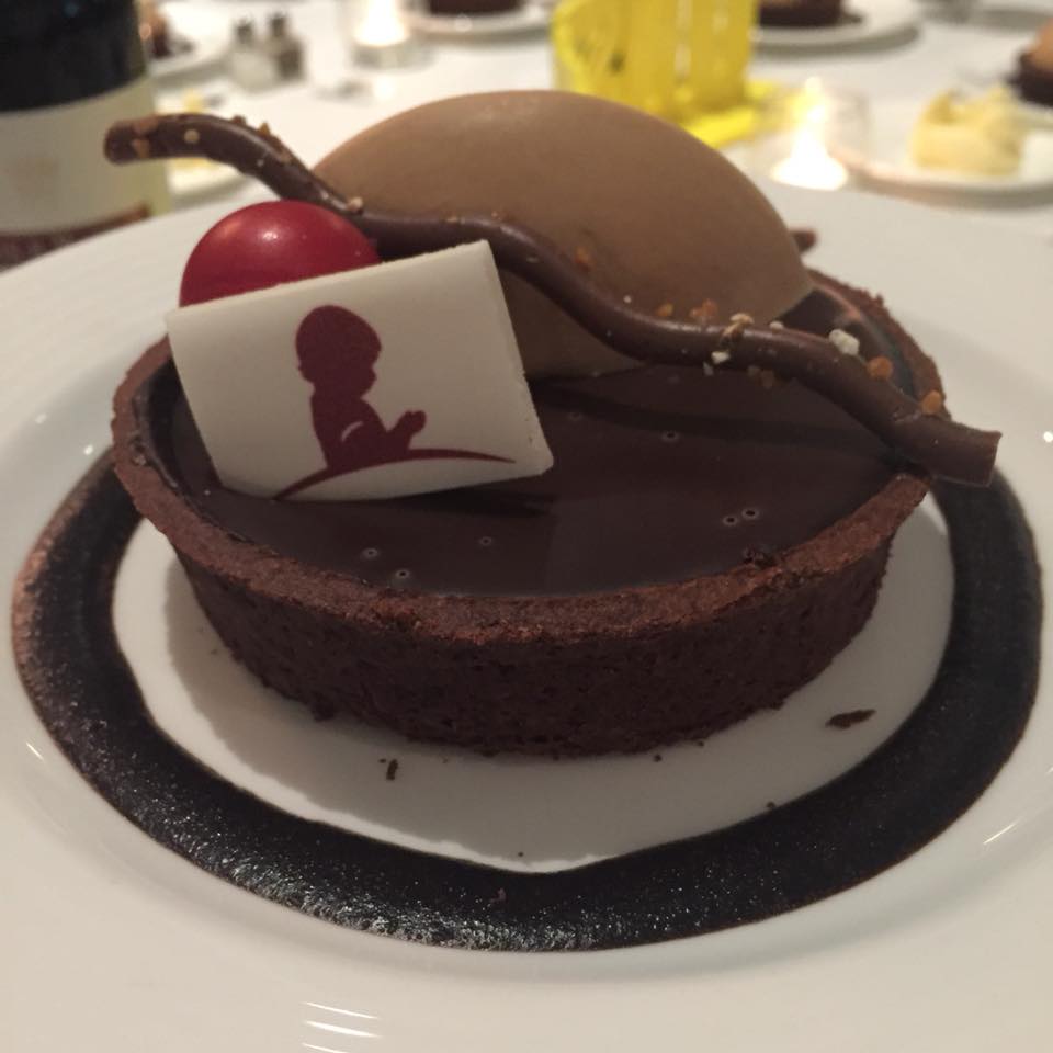 espresso bittersweet chocolate tart served with hazelnut cream