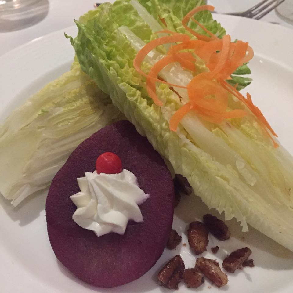 Hearts of romaine, merlot poached pear, whipped fromage blac, spiced peans, Peruvian pepper, white balsamic vinaigrette