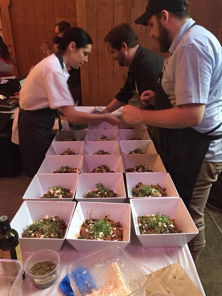 chefs prepping the next plated course