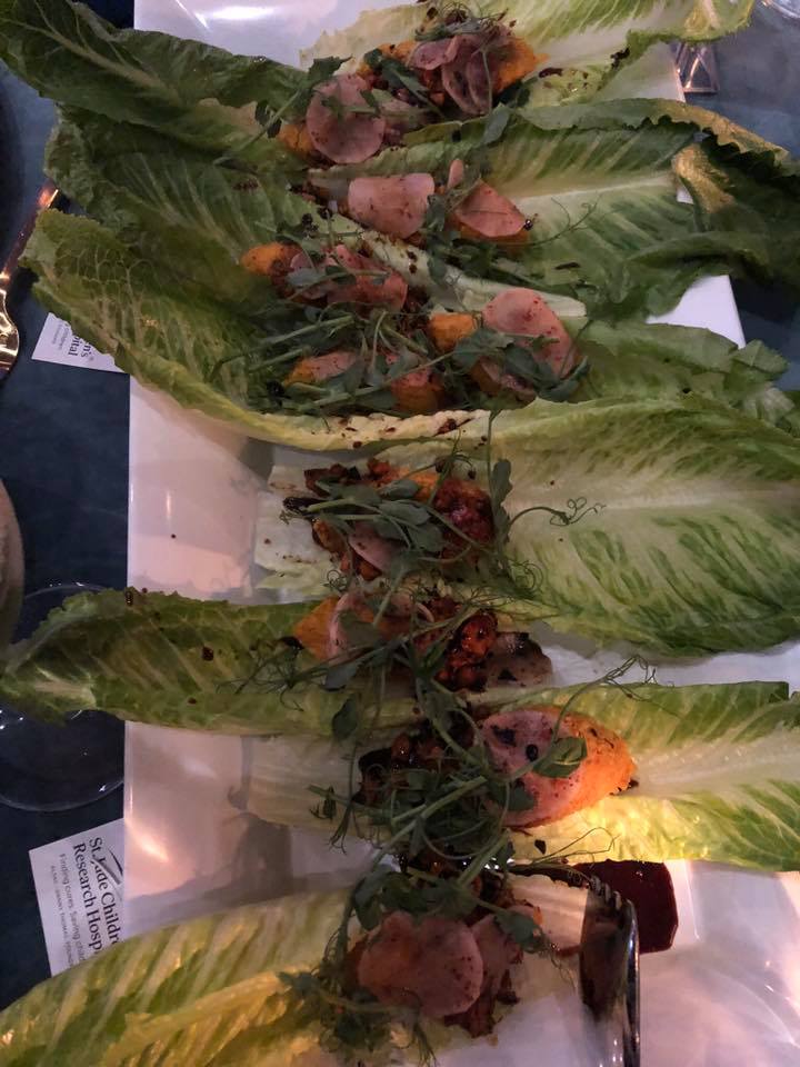 carrot kibbeh with jalapeno & cashew date dressing, radishes, pea tendrils and kaak spice on romaine