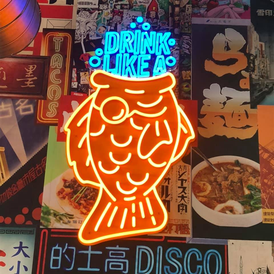 neon fish sign at Hawkers in East Nashville