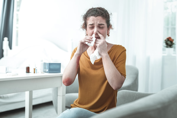 woman suffering from Chronic rhinitis