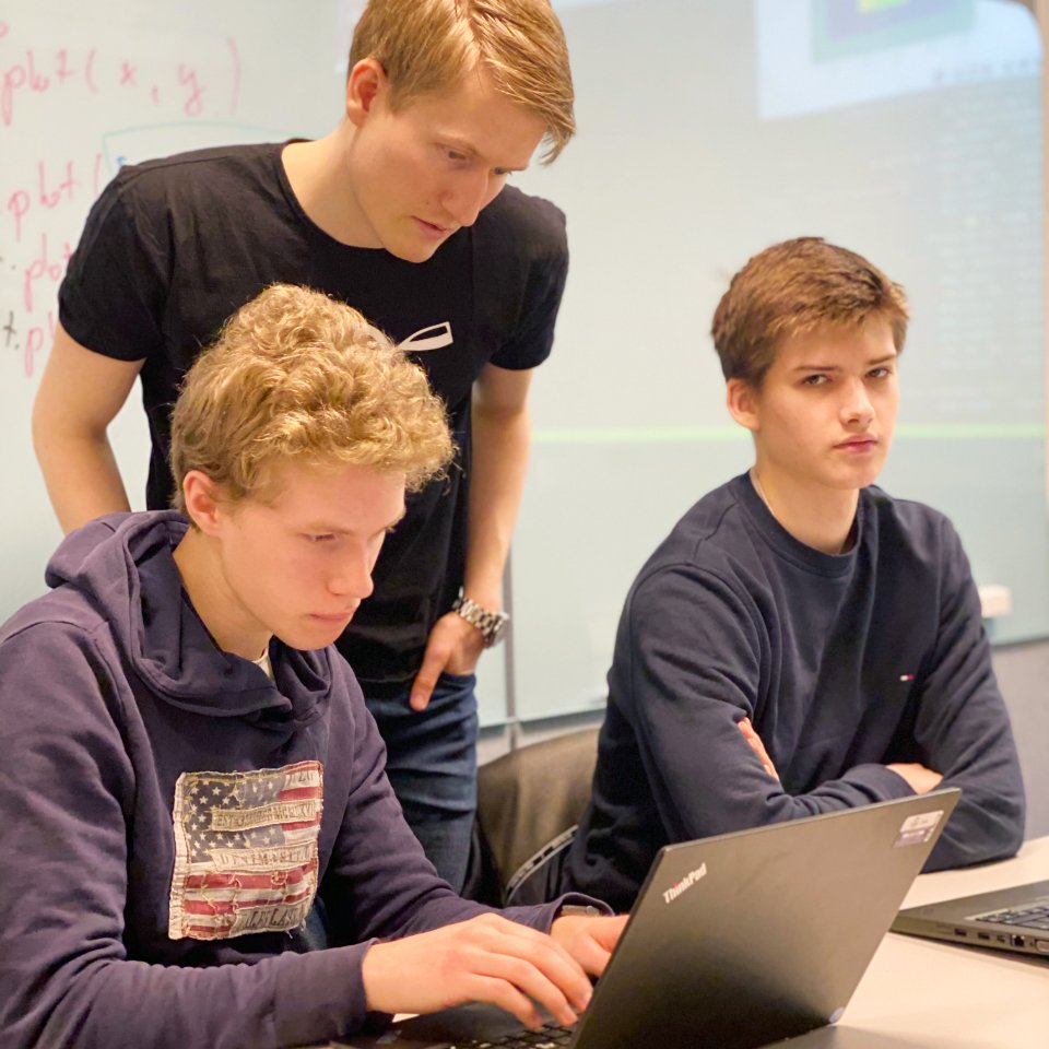Students learning artificial intelligence, machine learning and neural networks