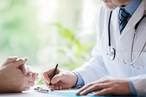 Physician discussing treatment with patient