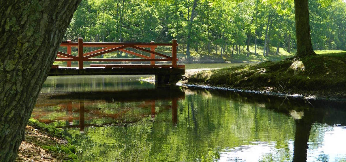 a bridge over a river at scioto trail state park