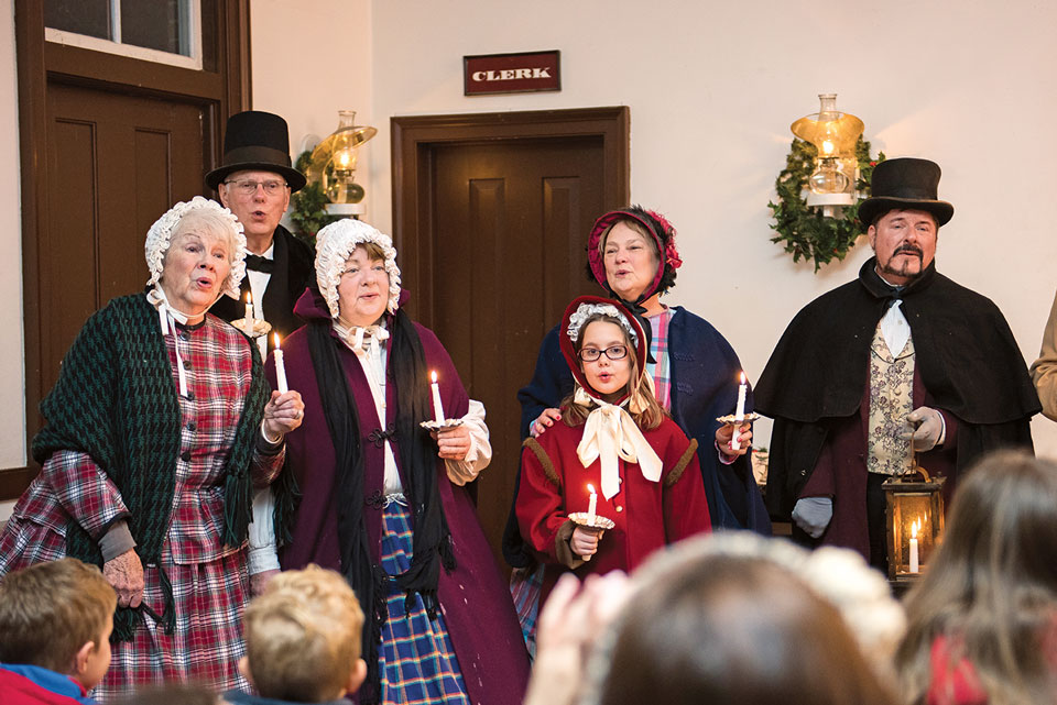 family of christmas carolers