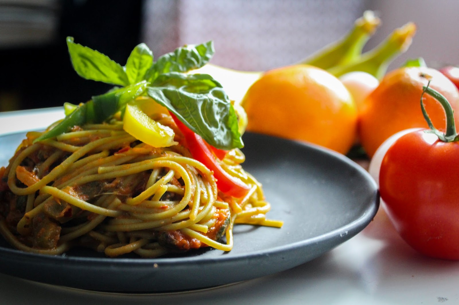 spaghetti dish next to fruit from Moretti's
