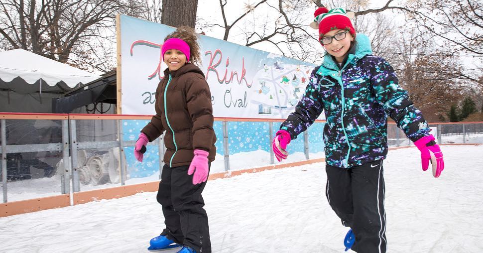 kids ice skating & smiling at The Rink at Wade Oval