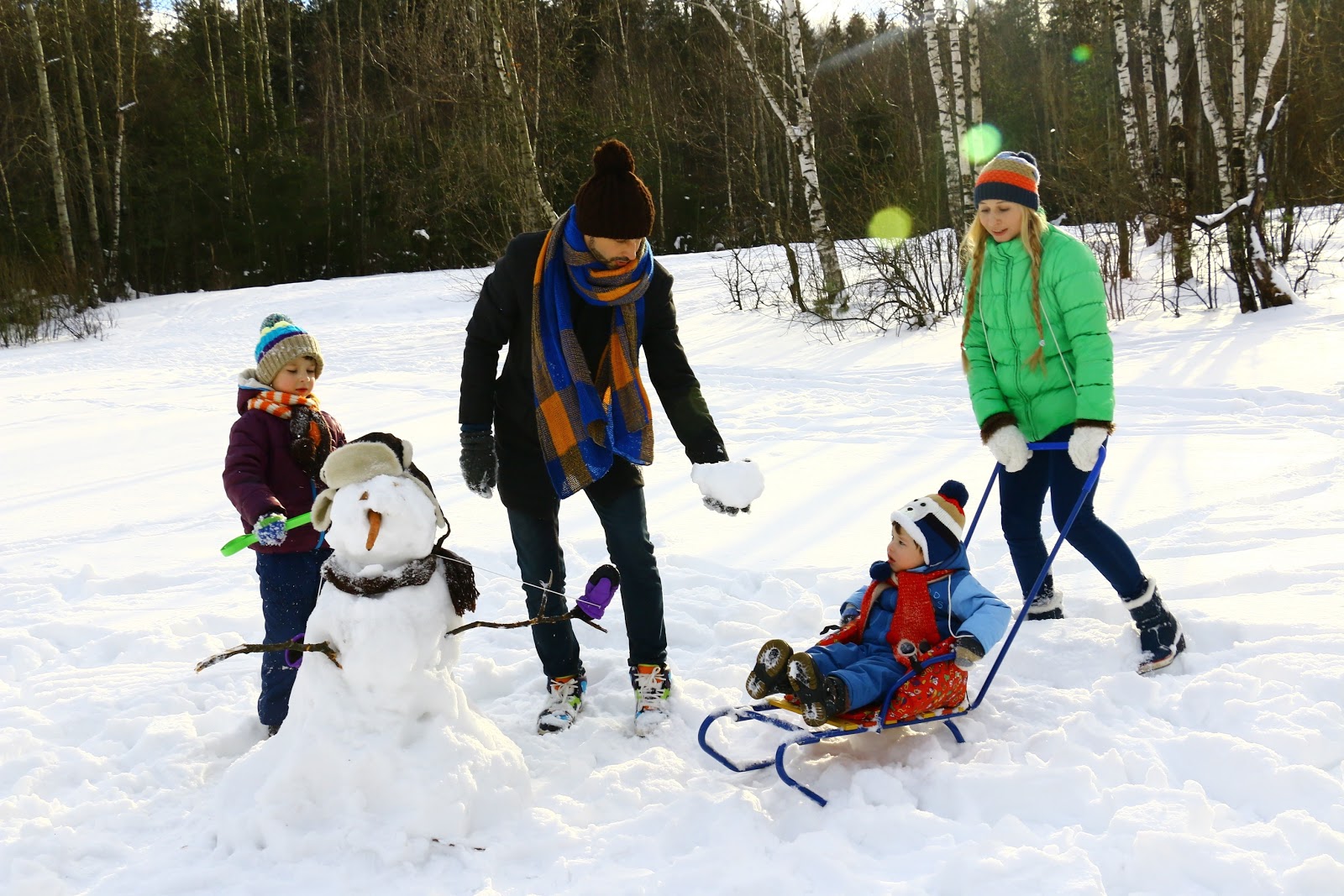 family doing outdoor winter activities