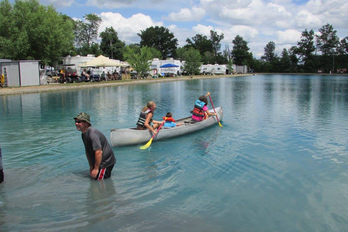 three girls canoeing at Blue Water Campground