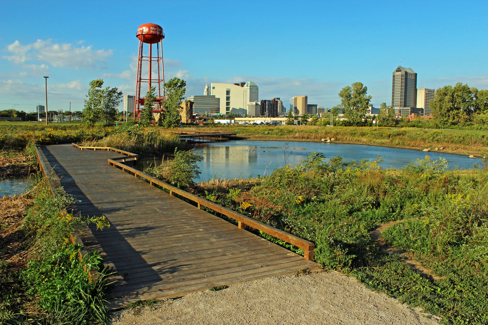 small wooden bridge and watertower at Scioto Audubon Metro Park