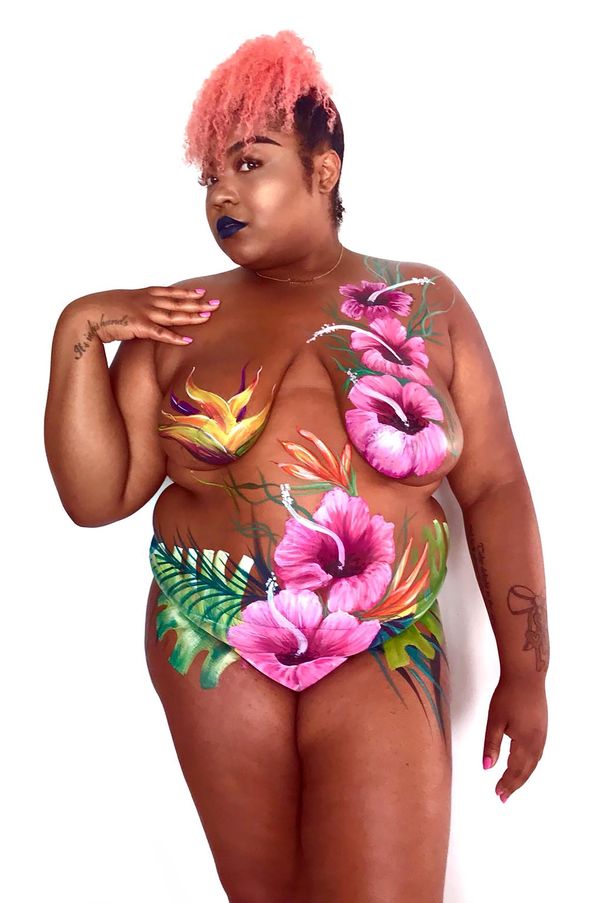 Lala Love posing naked with body art. Hair is in a pink updo