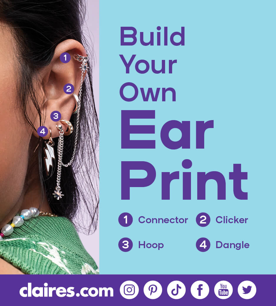 Closeup of a young lady's ear with a variety of piercings